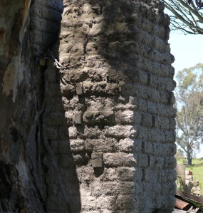 The collapsed house has a poor example of mud brick and regular kiln fired bricks in this chimney.